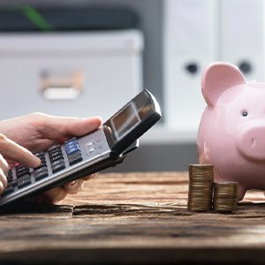 Pocket calculator and piggy bank