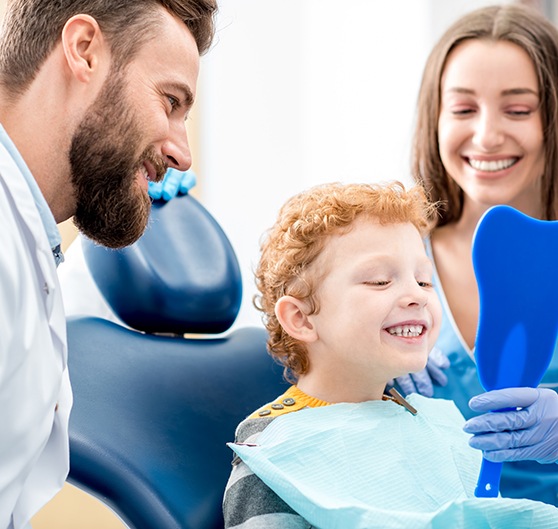 Child smiling in the dental chair