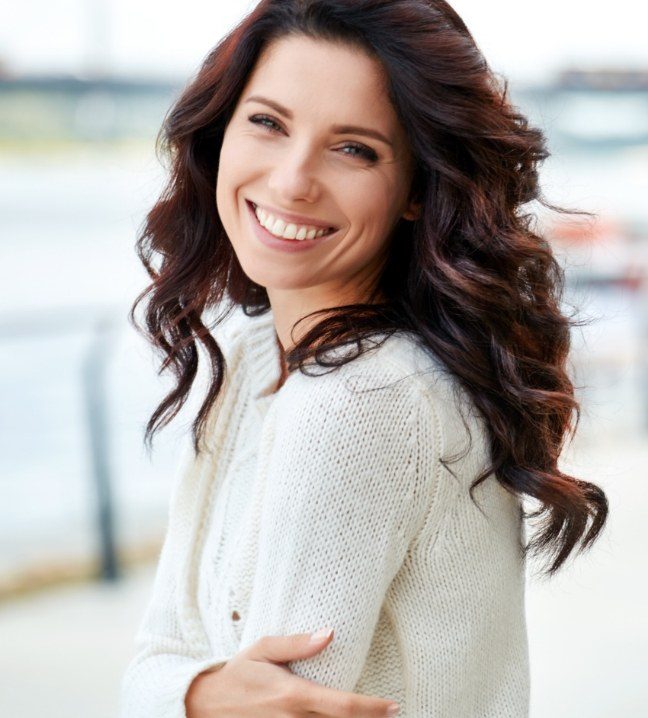 Woman smiling after preventive dentistry checkup and teeth cleaning visit