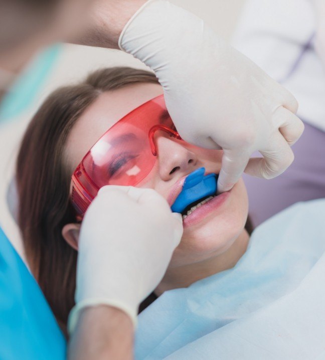 Dental patient receiving fluoride treatment
