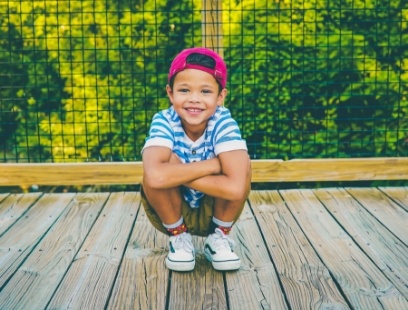 Child with healthy smile after children's dentistry visit