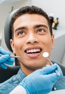 man visiting dentist for checkup 