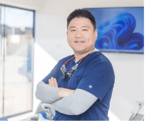 Patient talking with team member at front desk