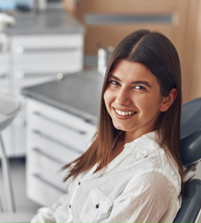 Smiling woman in dental treatment chair