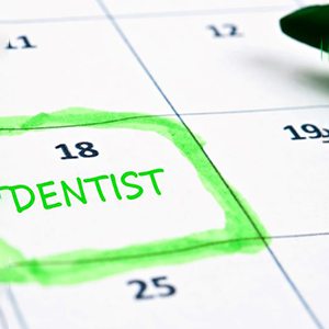 Dental appointment highlighted in green on calendar