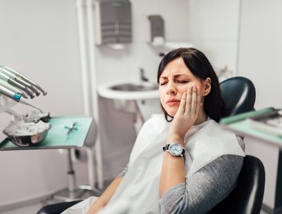Woman in pain before restorative dentistry