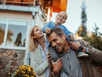 Family smiling together after emergency dentistry visit