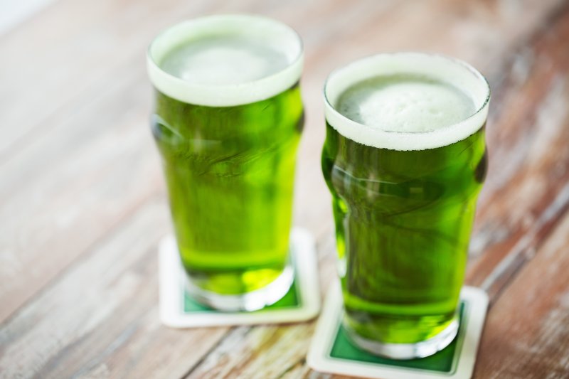 two glasses of dyed green beer